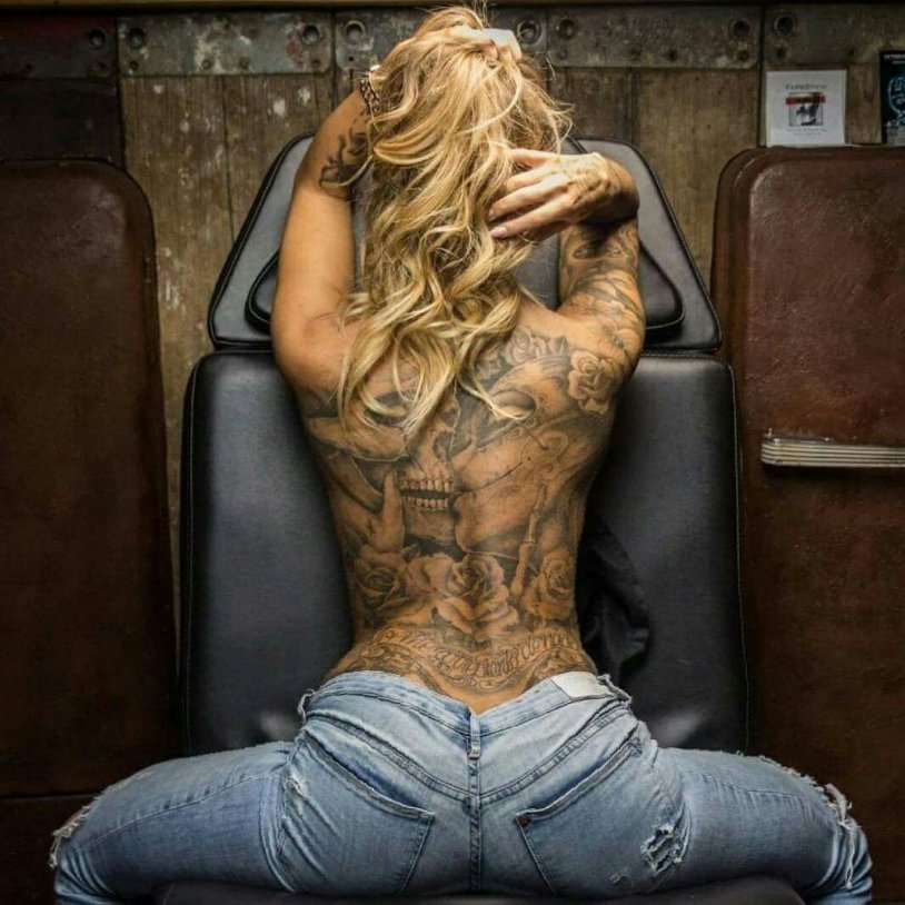 Blonde with a tattoo on the back