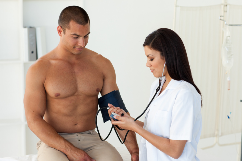 The doctor examines the man