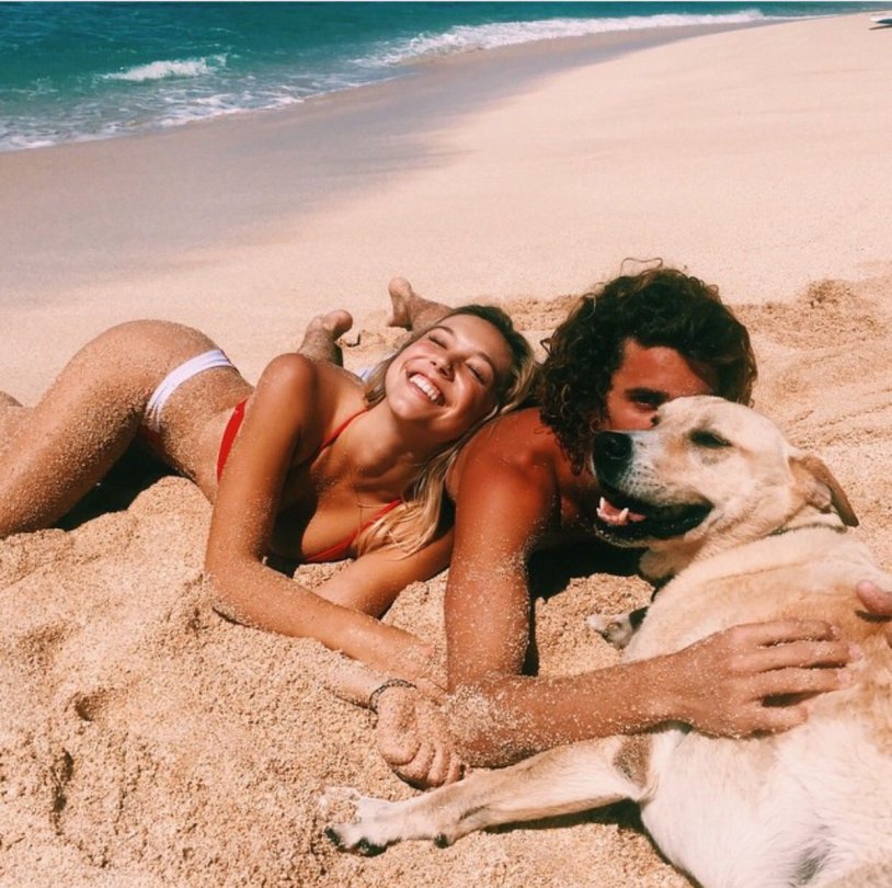 Girl with a dog on the beach