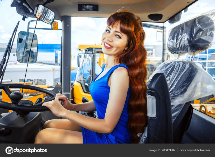 Girl in the cabin of the tractor