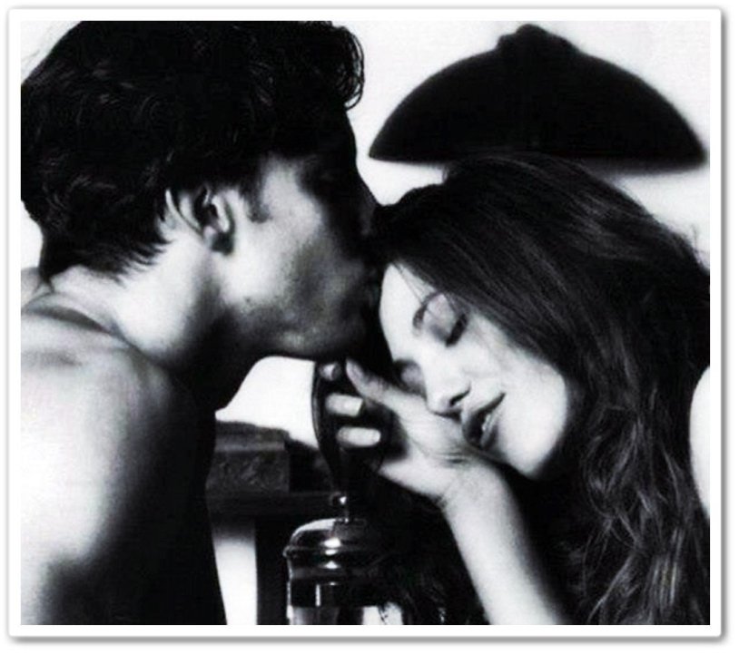 The guy kisses the girl's forehead