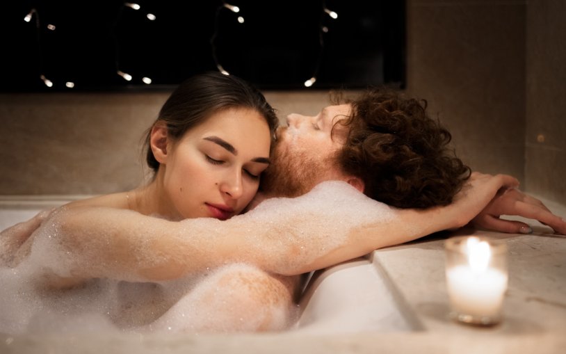 A guy with a girl in a bath