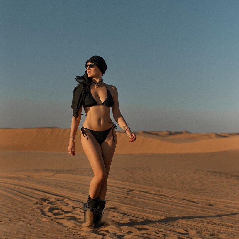 Girl in the desert in a swimsuit