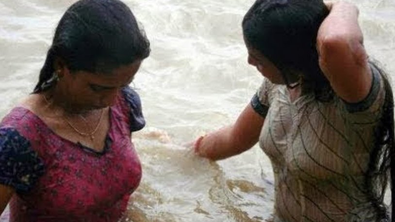 Indian woman in wet clothes