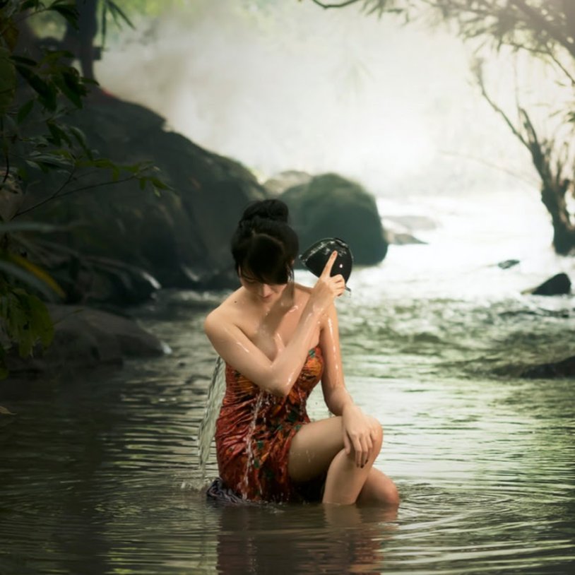 Girls swim in the river