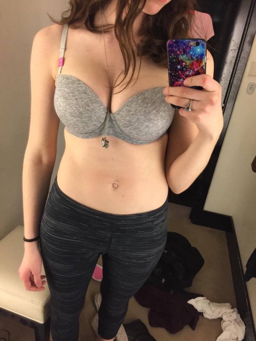 Girl in the fitting room in a bra
