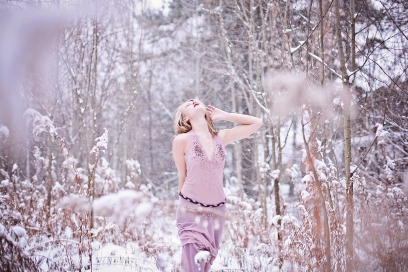 Girl in the snow forest