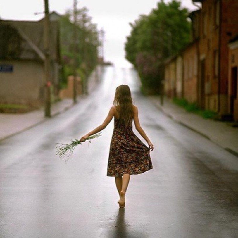Girl walks along the road