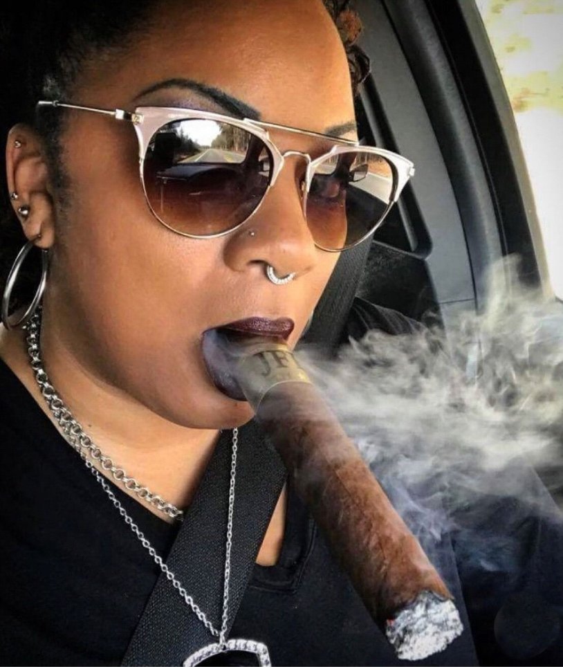 Cuban girl with a cigar