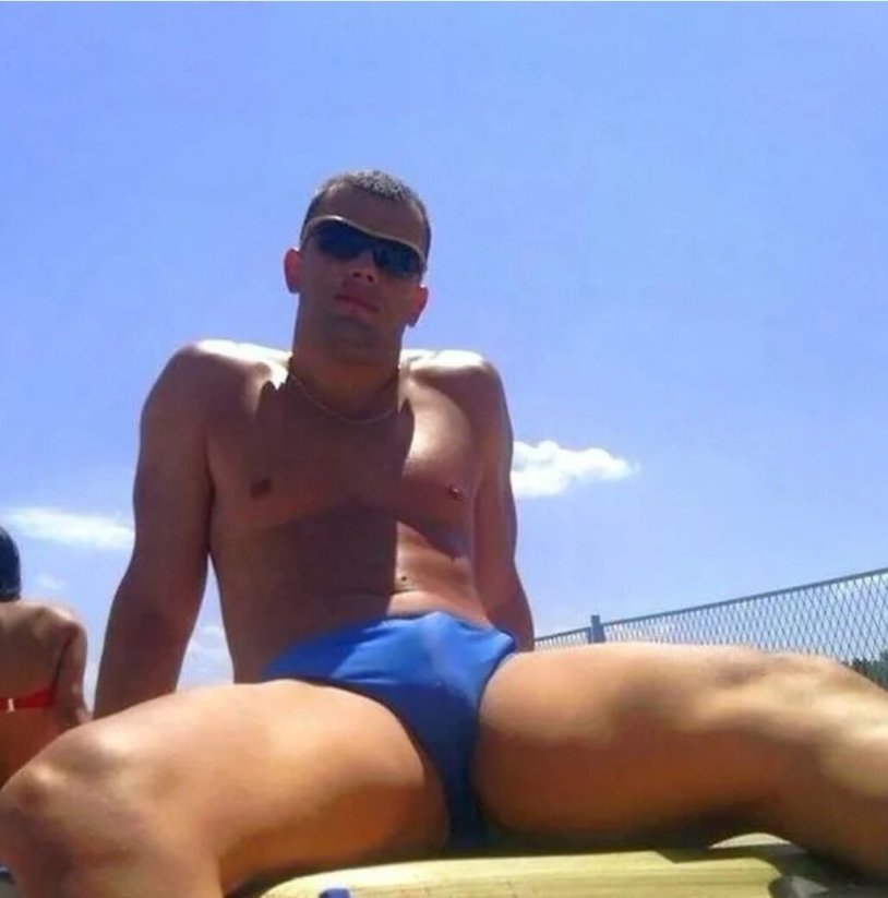 Russian guys in shorts on the beach