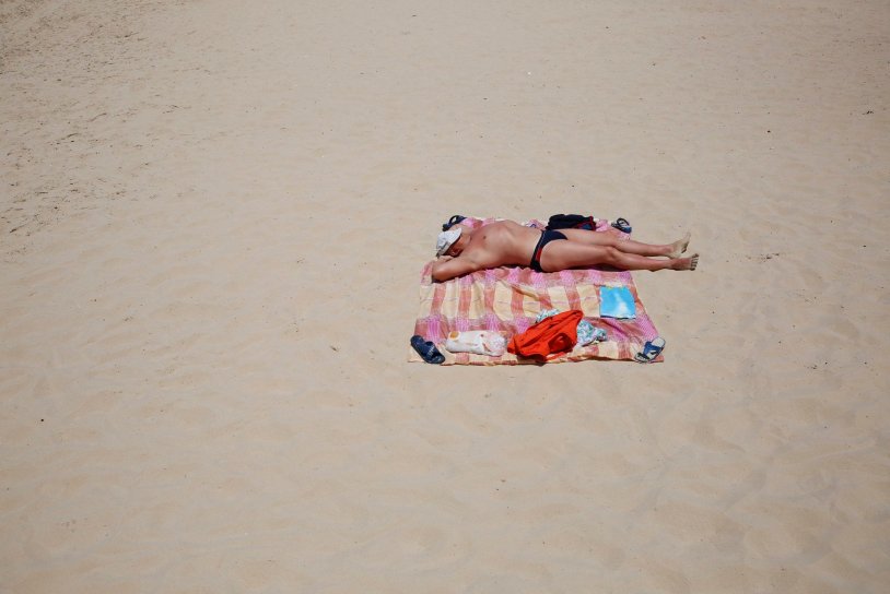 We sunbathe on the beach