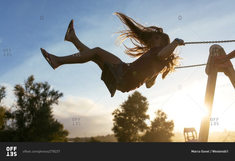 Girl swinging in the wind
