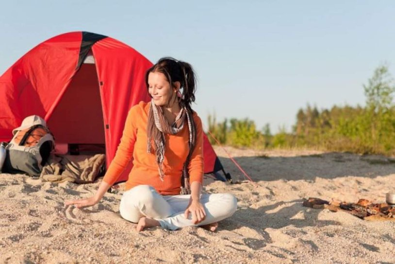 Girl in a tent on the beach