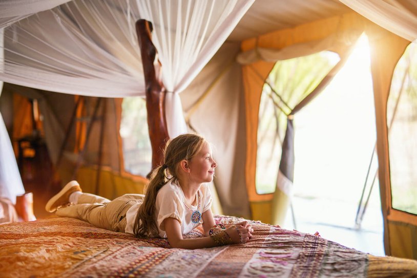 Photo session of a girl in a safari tent