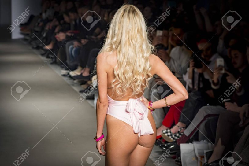 Model blonde without lingerie on the catwalk
