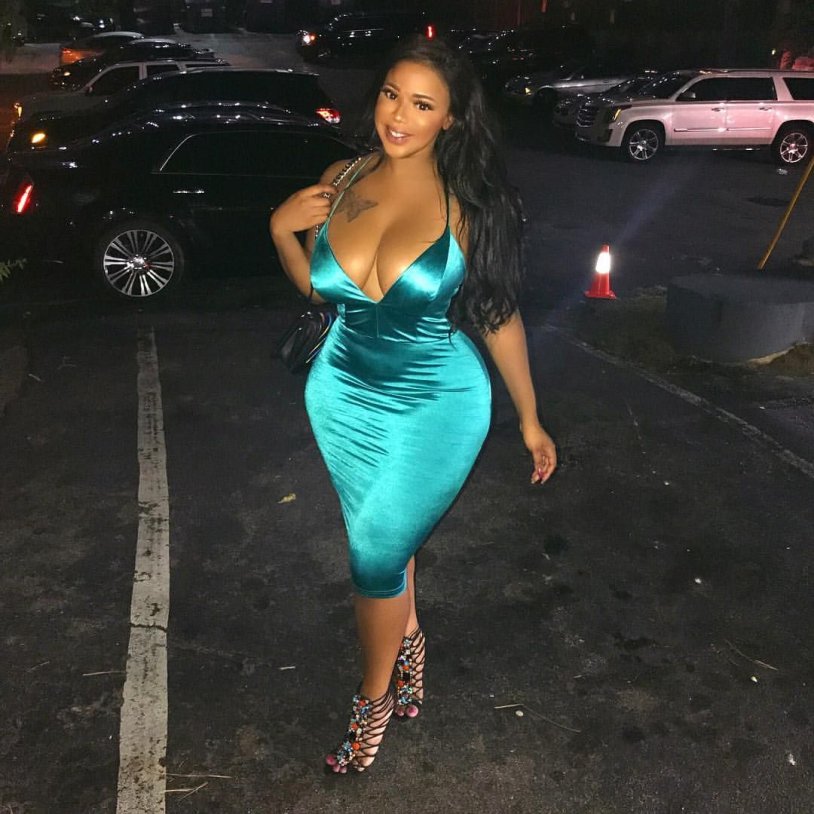 The guy holds the girl by the chest black and white