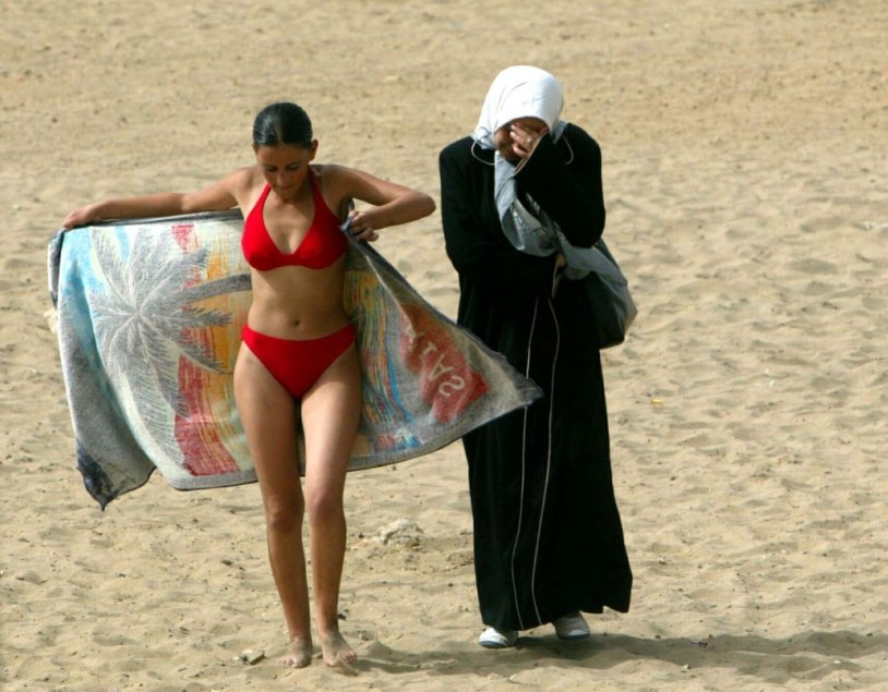 Muslim women on the beach in a swimsuit