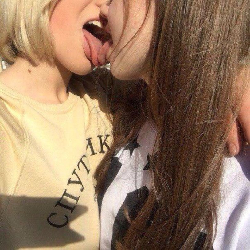 Two girls with tongue