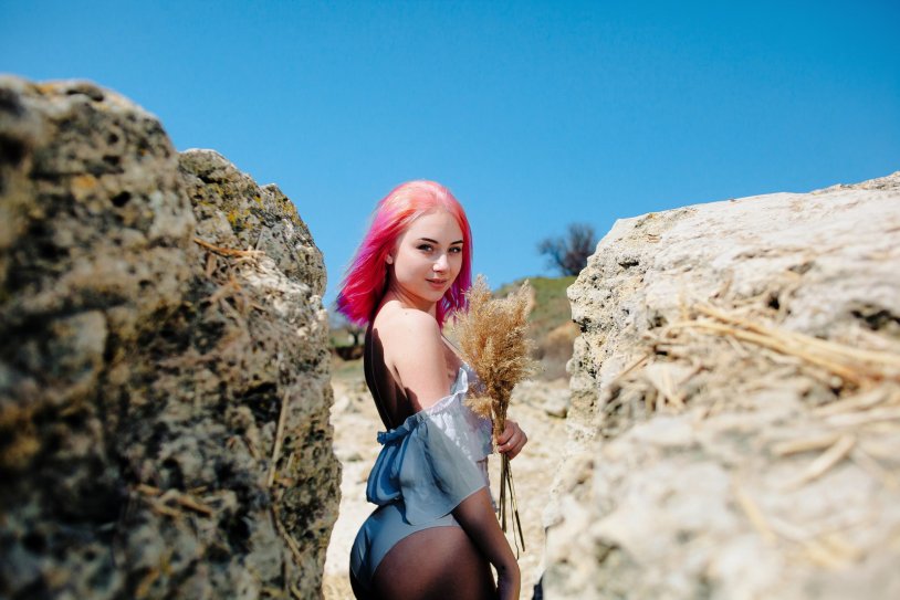 Girls with pink hair on the beach