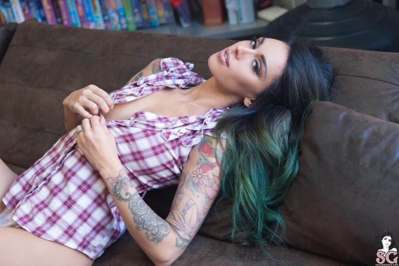 Blue-eyed brunette with a tattoo