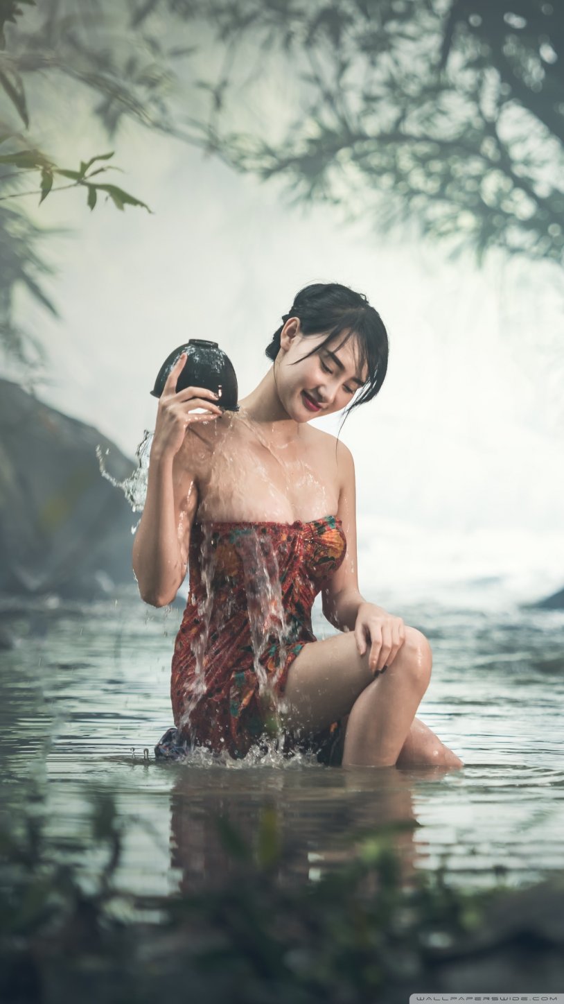 Asian girl bathes