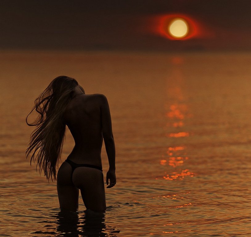 Girl on sunset beach
