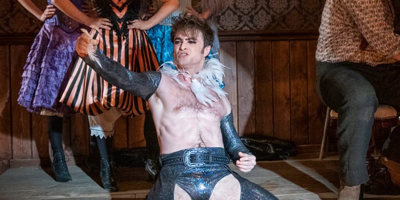 Daniel Radcliffe dancing in feathers