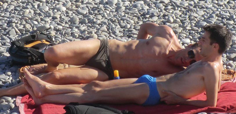 Man in swimming trunks sunbathing
