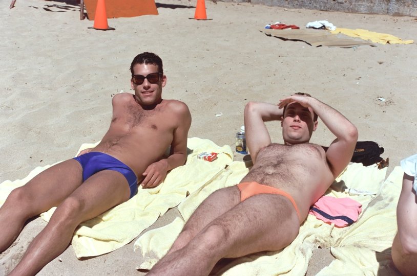 Guy sunbathing on the beach