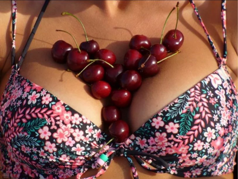 Cherries on a woman's body