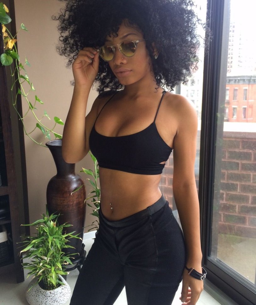 Naked busty beauty with afro hairstyle