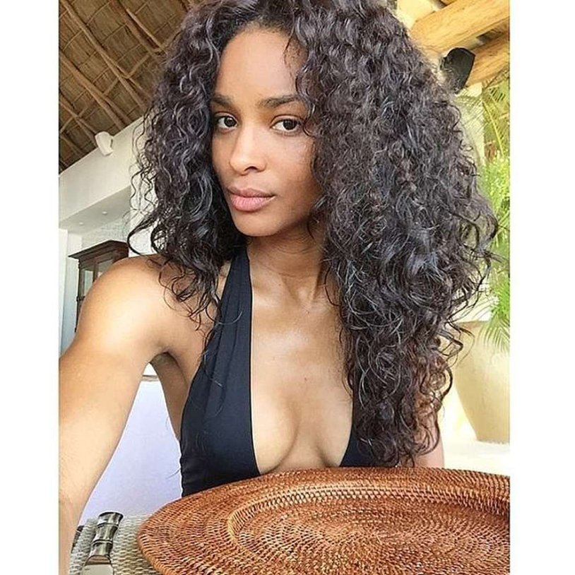 Curly girl in a swimsuit