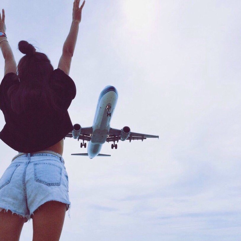 Girl on the background of the plane