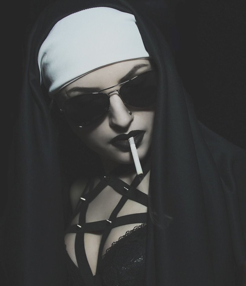Nun with a cigarette