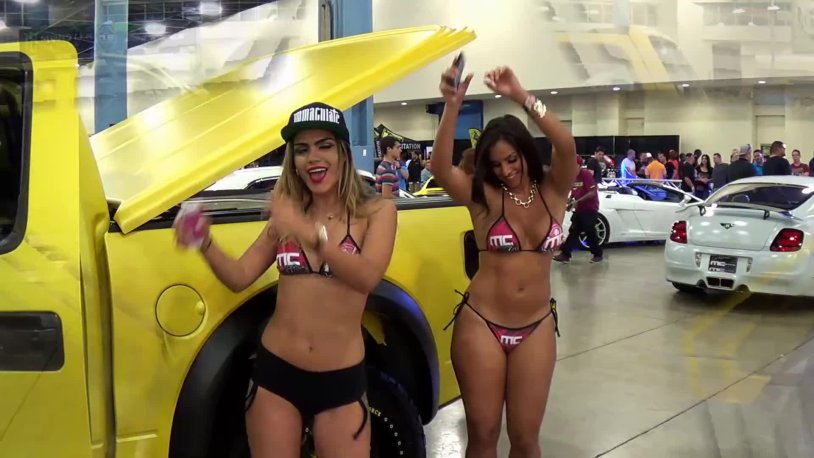 Girl in bikini washing car