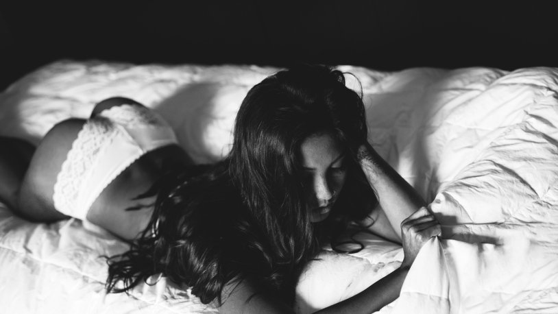 Brunette girl in bed