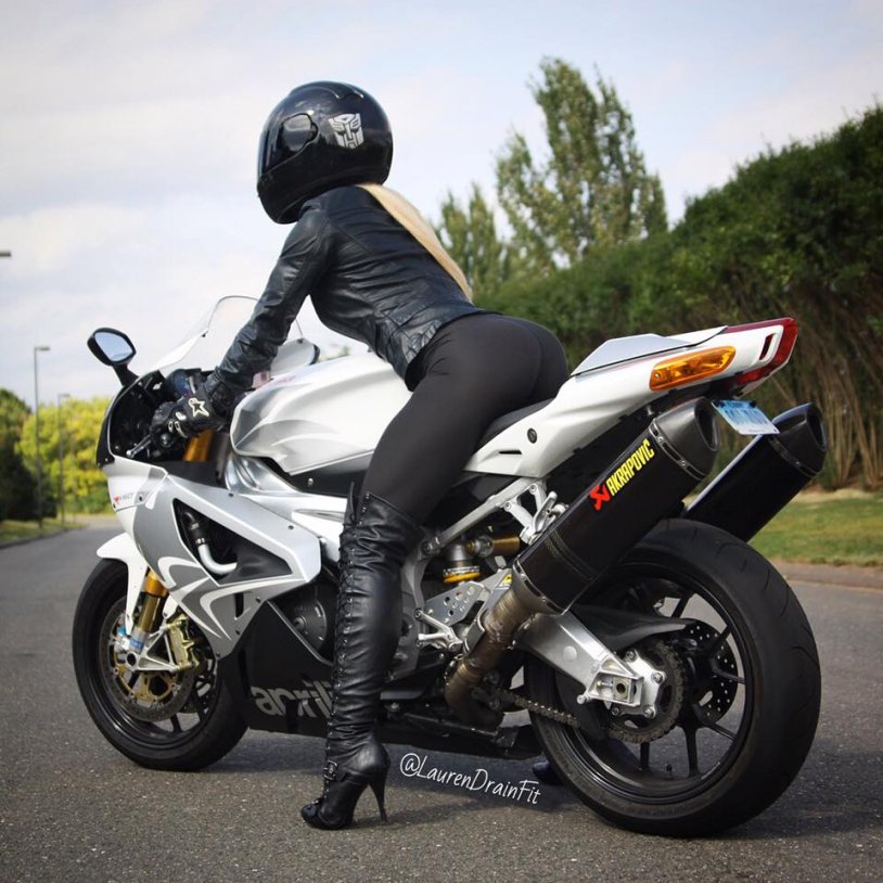 Girl on a motorcycle from behind
