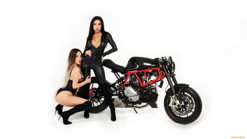 Beautiful girl at the motorcycle on the highway