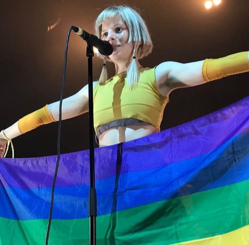 Aurora Axnes with LGBT flag