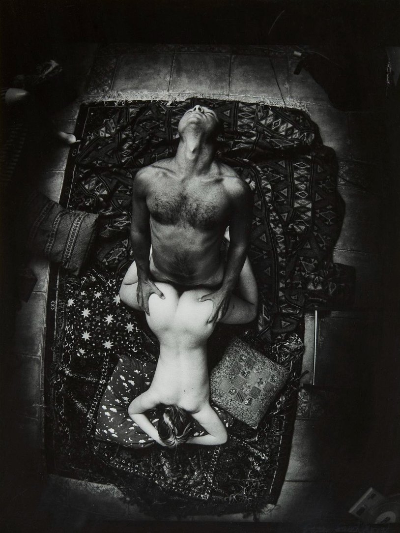 Woman photographer and naked men