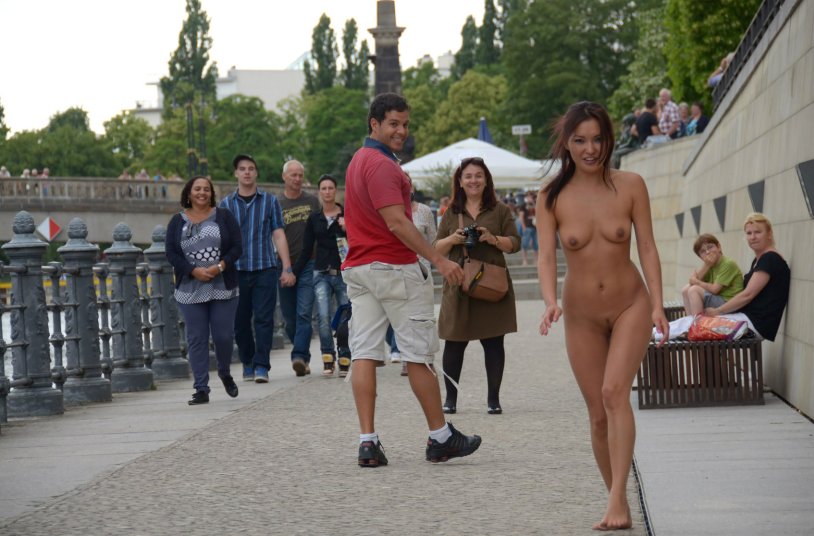 Asian walks naked along the street