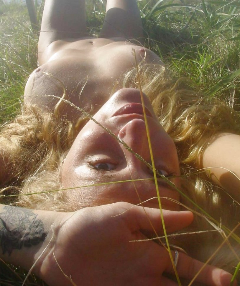 A woman lies on the grass