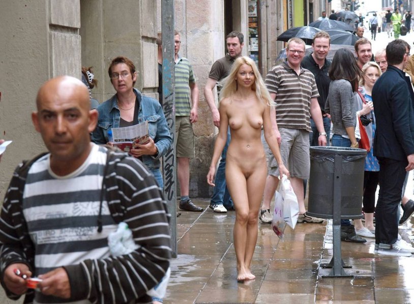 Woman undresses in public