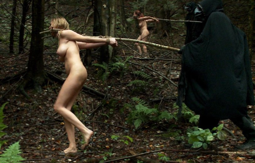 Naked connected slaves in the forest