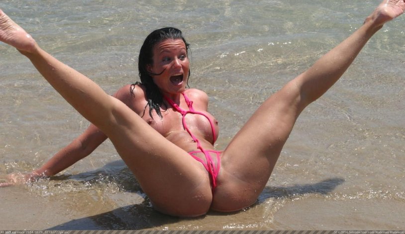 A placed legs on the beach without a bikini