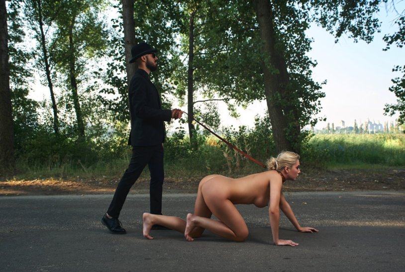 BDSM girl on a leash walk