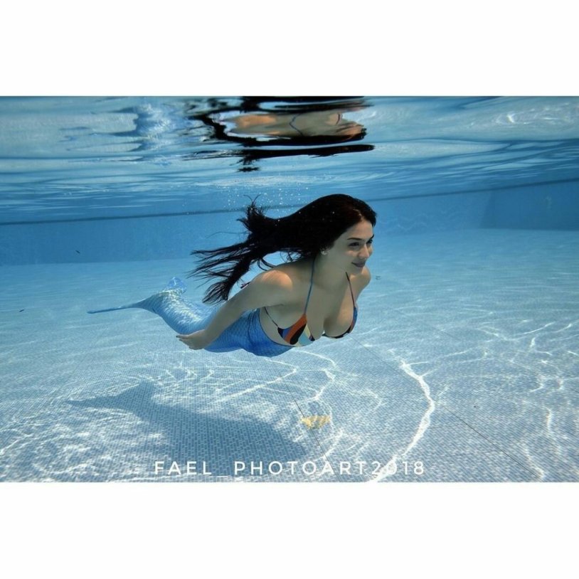 Girl sinking in the pool