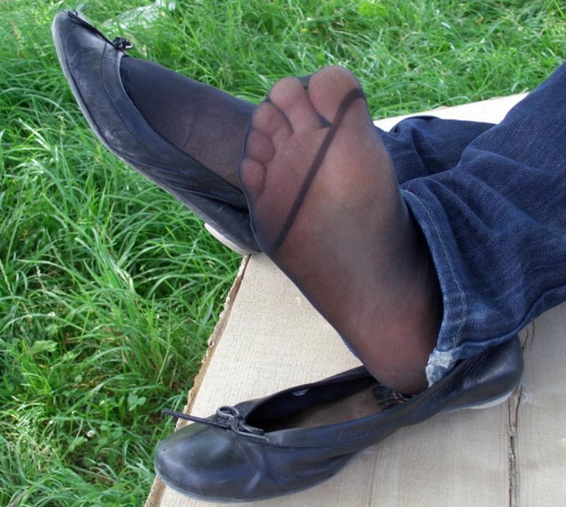 Feet in ballet shoes and tights