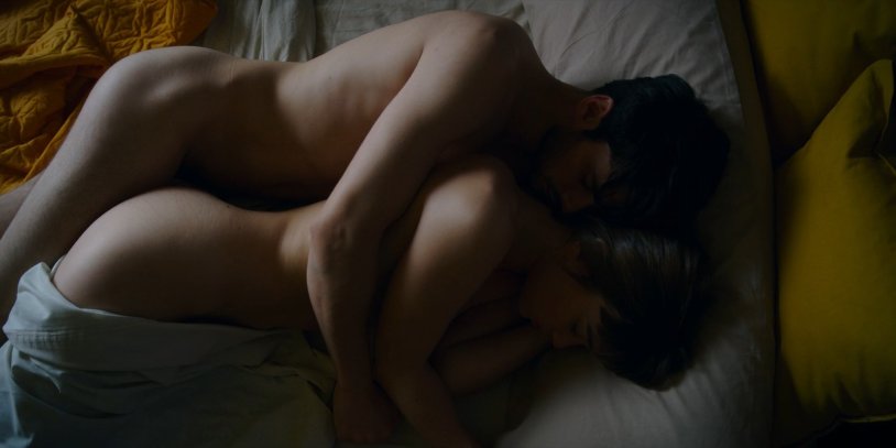 Man and woman naked in bed