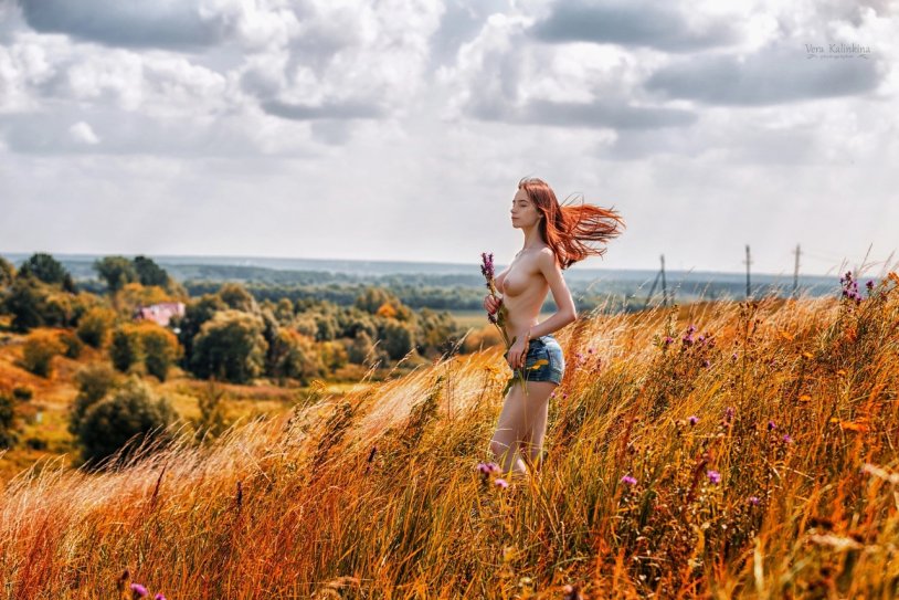 Red girl in the field